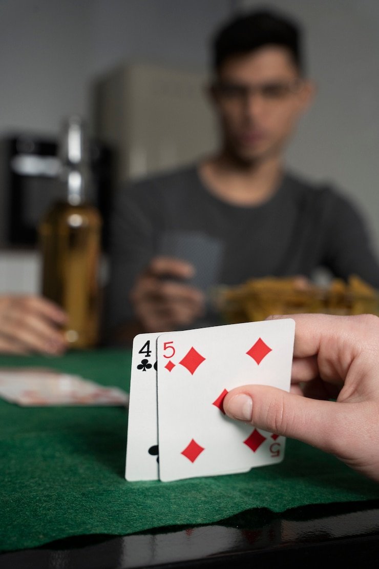 Play'n GO live baccarat table displayed on mobile phone with dealer visible in HD video stream